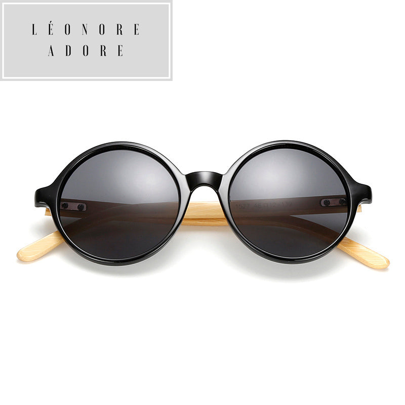 Occhiali da sole rotondi in bambù. L'eleganza è nella consapevolezza della materia.
