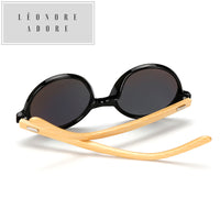 Occhiali da sole rotondi in bambù. L'eleganza è nella consapevolezza della materia.