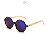 Occhiali da sole rotondi in bambù. L'eleganza è nella consapevolezza della materia.