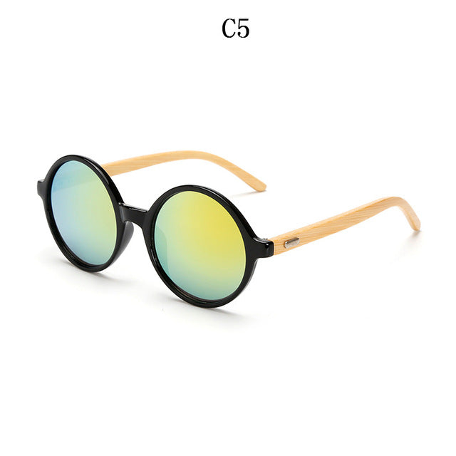 Occhiali da sole rotondi in bambù. L'eleganza è nella consapevolezza della materia.