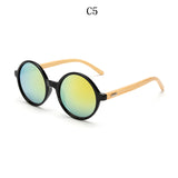 Occhiali da sole rotondi in bambù. L'eleganza è nella consapevolezza della materia.