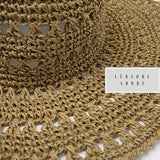 Beach hat made of bamboo straw, braided in hand. Redonate sweetness to summer.